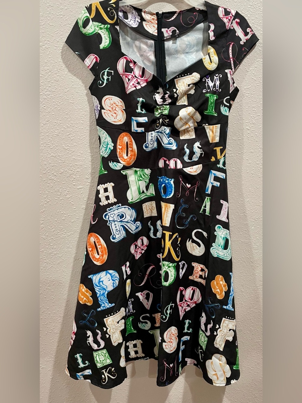 Black Fit-and-Flare Dress with Colorful Letter Print